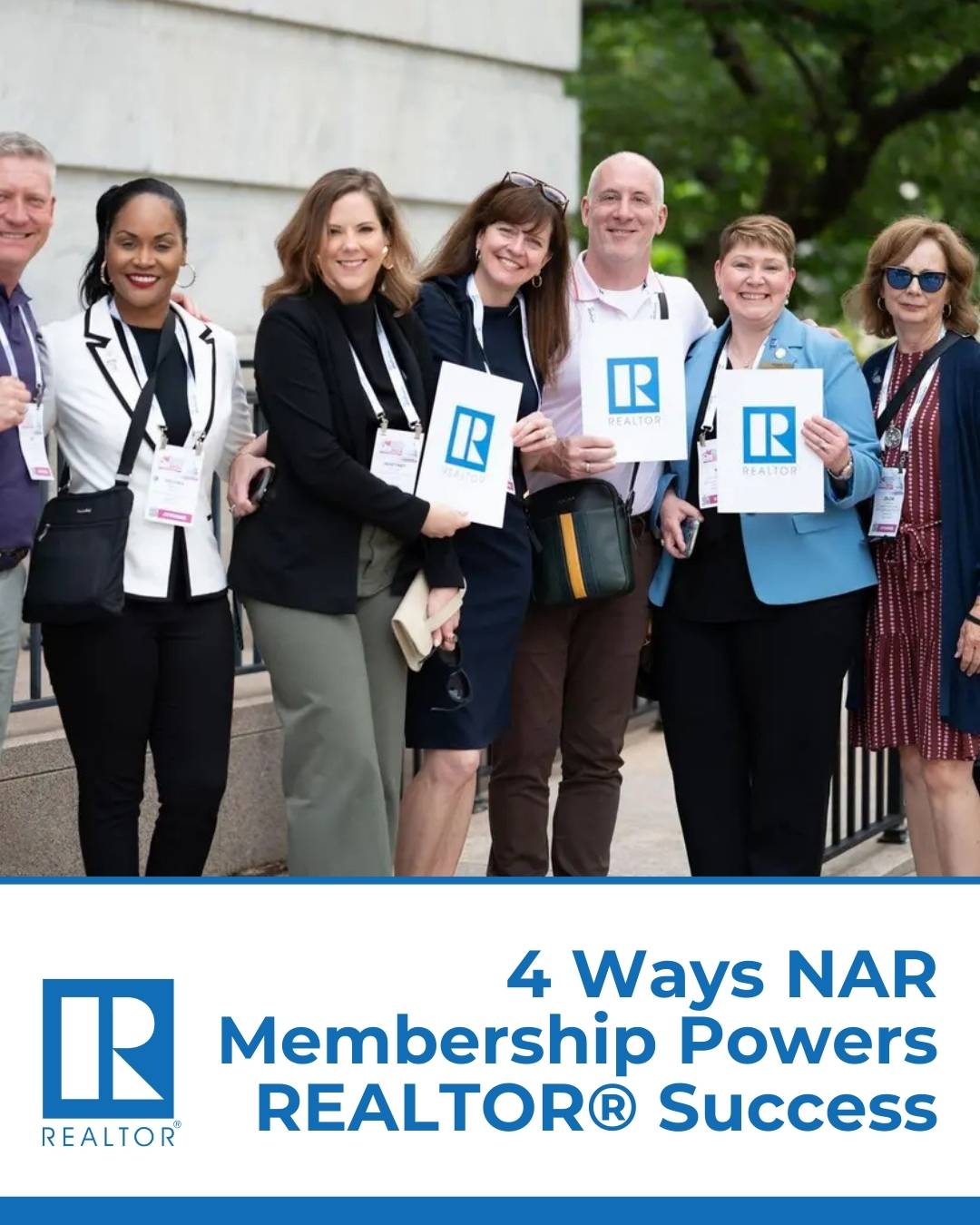 NAR Realtors Standing Outside For A Group Photo Holding NAR Realtor Signs